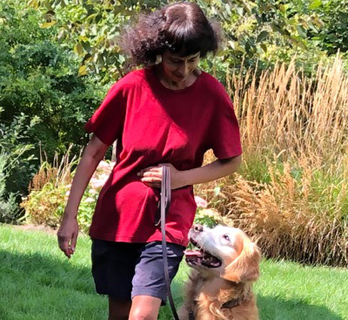 Anne walking with her golden retriever